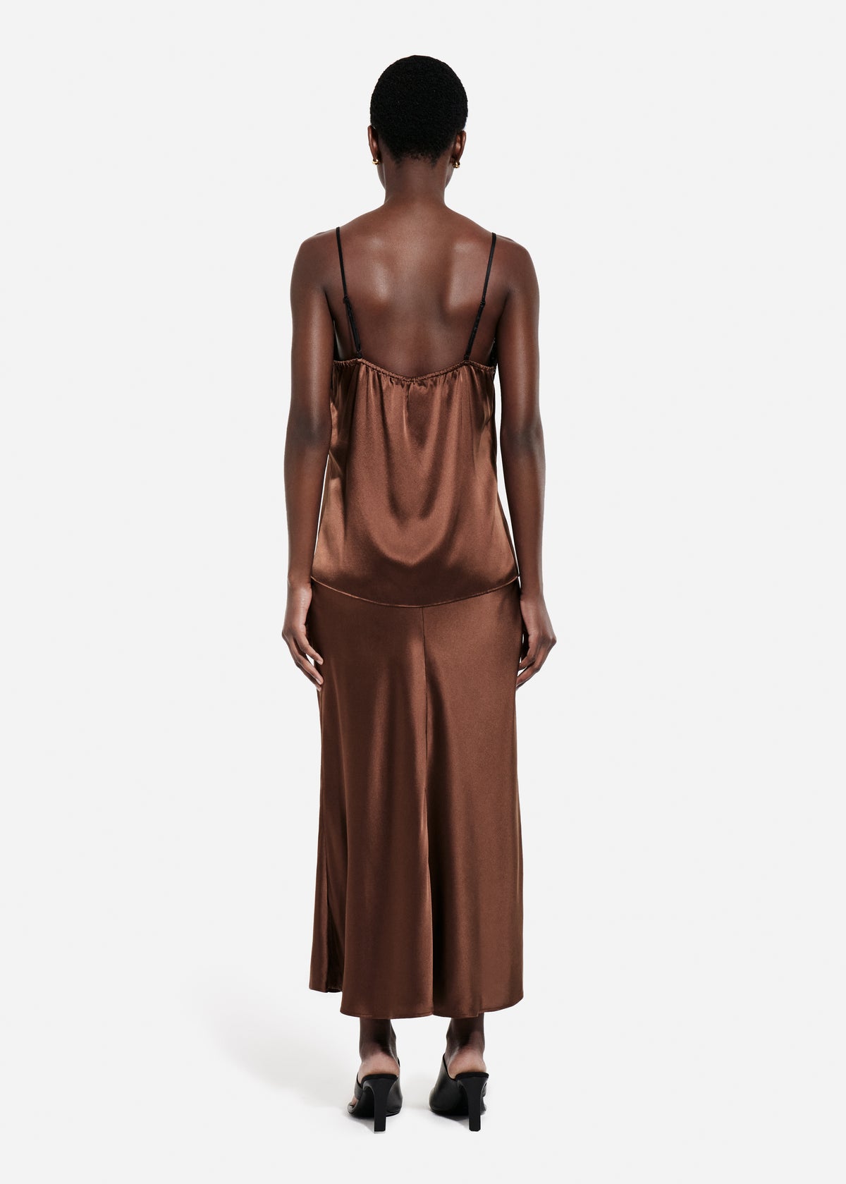 Bias Cut Slip Skirt in Silk - Chocolate, Woman wearing a brown satin top and skirt with a plain white background back, image 3 of 4